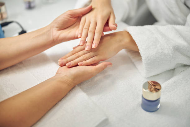 istock Woman visiting spa salon for natural manicure 1264574212