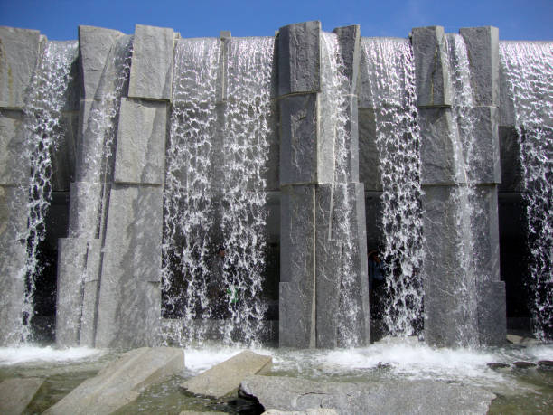 Waterfall at Martin Luther King, Jr. Memorial at Yerba Buena Gardens San Francisco - July 11, 2010:  Waterfall at Martin Luther King, Jr. Memorial at Yerba Buena Gardens.  The vision of peace and international unity is enshrined in this memorial featuring a majestic waterfall and shimmering glass panels inscribed with Dr. Kingâs inspiring words, poems and images from the civil rights movement. Artist and sculptor, Houston Conwill, created this memorial in collaboration with poet Estella Conwill Majoza and architect Joseph De Pace. civil rights photos stock pictures, royalty-free photos & images