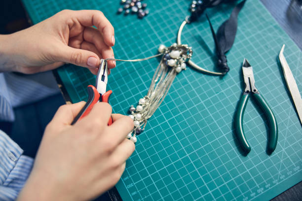 istock Accurate work of jewel employee with a tool 1264577983
