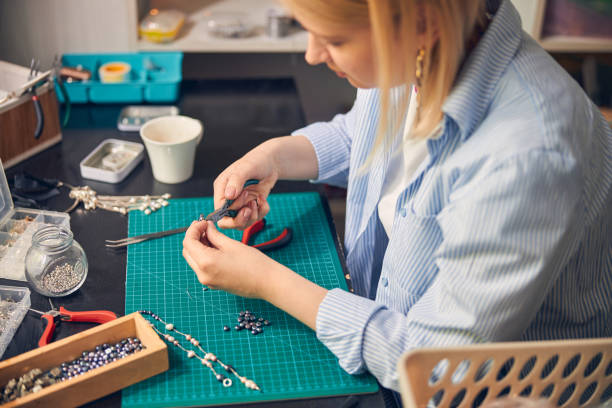 istock Caucasian female making bijouterie goods in workshop 1264577984
