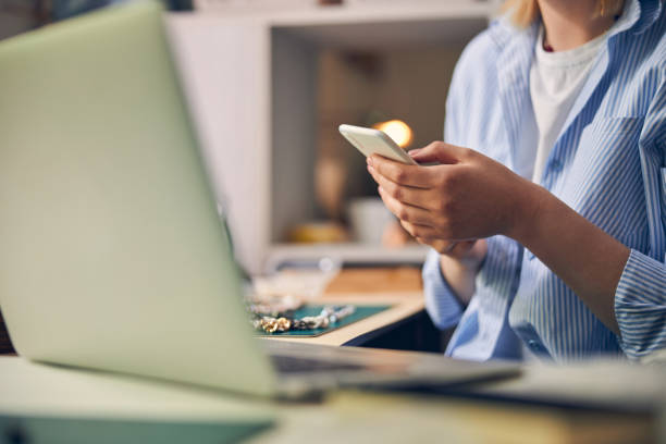 istock Caucasian woman using a smartphone in office 1264578012