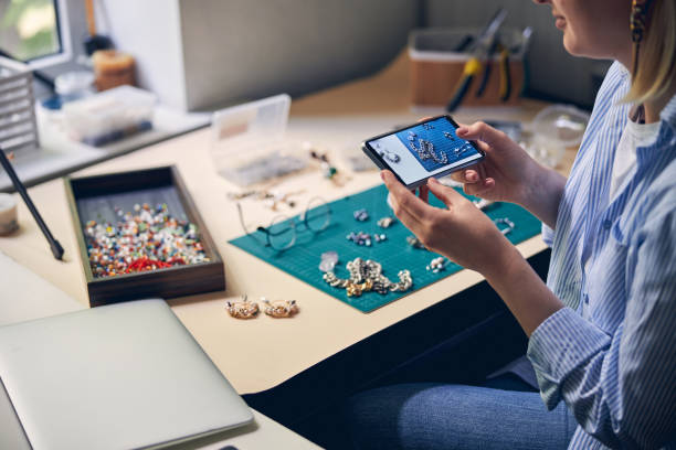istock Bijouterie speciaist taking a picture of working table 1264578020