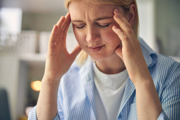 istock Overworked blonde woman feeling pain in head 1264578052