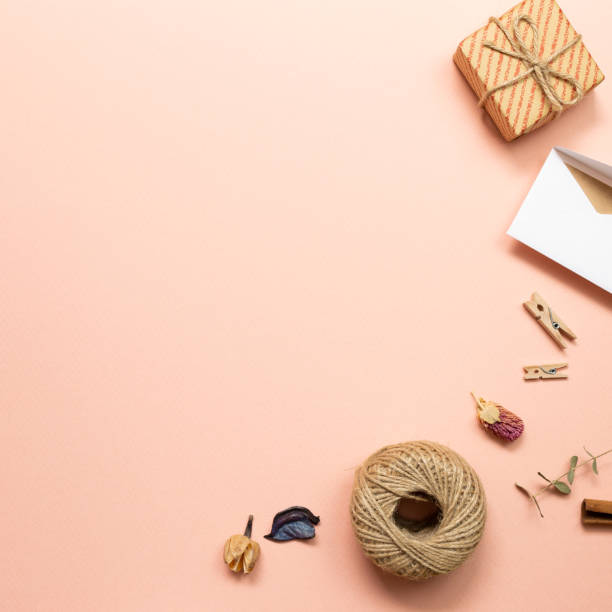 istock Gift box and card with dry plant on pink background. flat lay, top view, copy space 1264581108