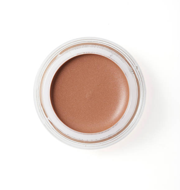istock Brown color cheek make up in round container on background 1264581773