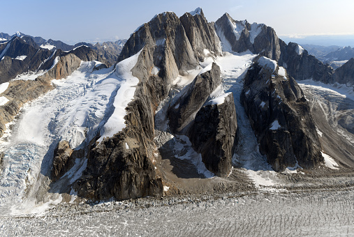 Iconic complex of particularly difficult to climb rock peaks called Mooses Tooth (10,335 feet/ 3139 m) or Moose’s Tooth, located near the Ruth Gorge in Central Alaska Range, within Denali National Park. East-to-west summit ridge is nearly mile-long.