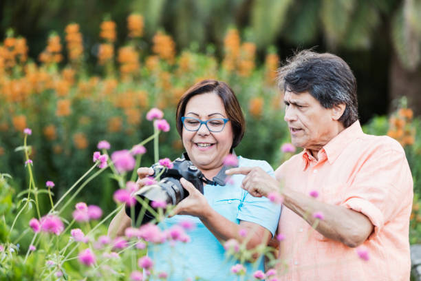 istock Senior Hispanic couple photographing nature 1264586903
