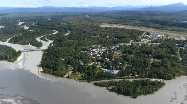 Talkeetna, Alaska Small town of Talkeetna, lovely located at the confluence of Susitna (darker water) and Talkeetna (brighter water) Rivers, Central Alaska, USA. Downtown and the airport on the right side. talkeetna mountains stock pictures, royalty-free photos & images