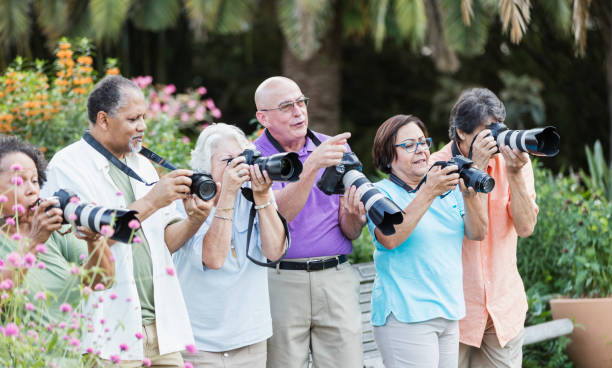 istock Group of seniors on sightseeing tour with cameras 1264587787
