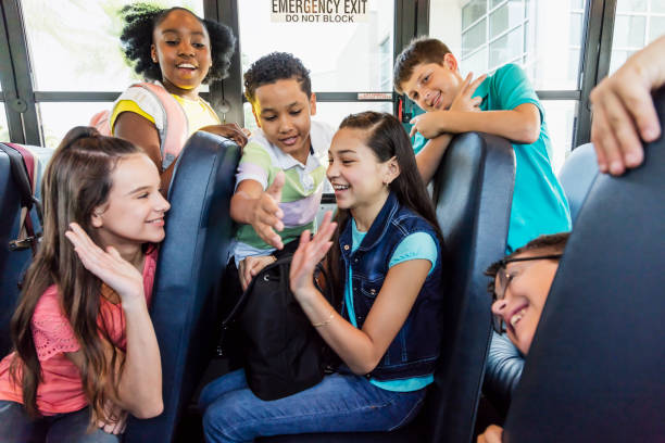 istock Students riding school bus, boy with down syndrome 1264589348