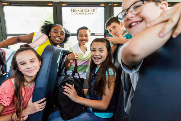 istock Students riding school bus, boy with down syndrome 1264589350