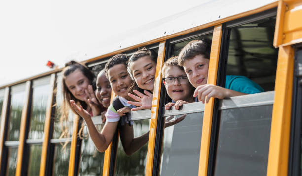 istock Students riding school bus, boy with down syndrome 1264589906