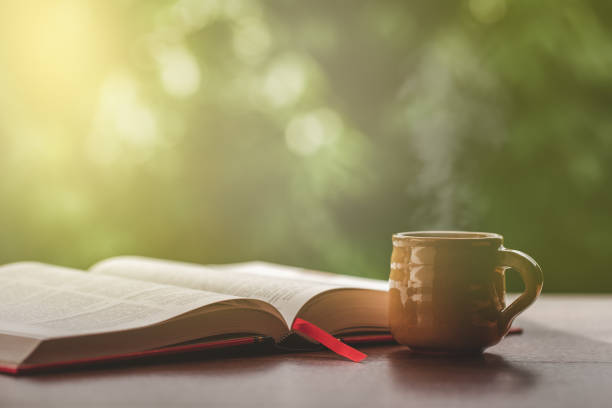 istock Hot tea, smoke, with books with beautiful nature background. 1264591596