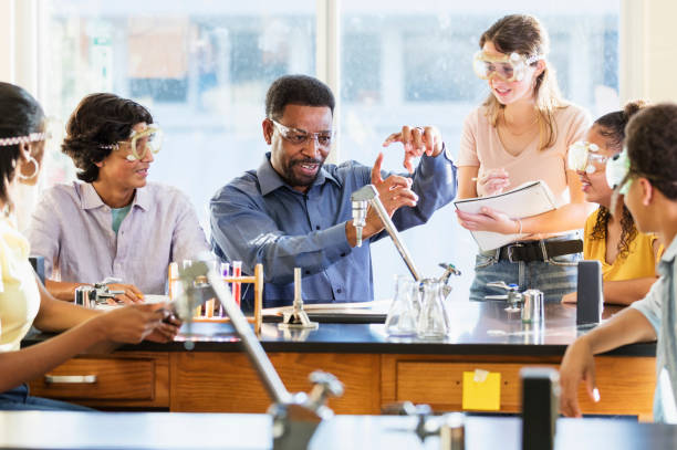 istock African-American man teaching high school chemistry lab 1264594592