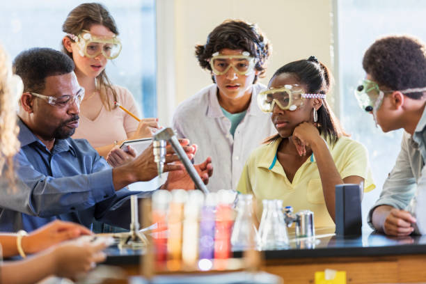 istock African-American man teaching high school chemistry lab 1264595188