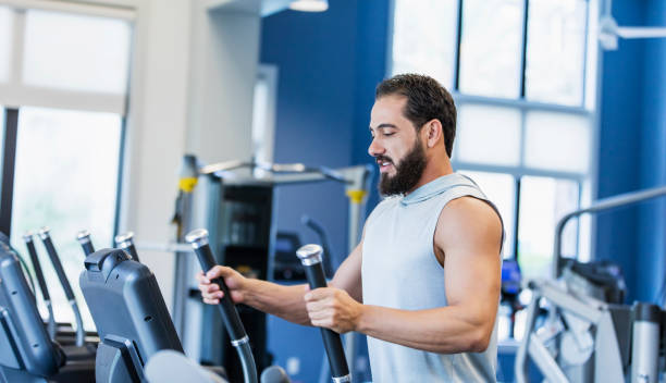 istock Middle Eastern man exercising at the gym 1264595529