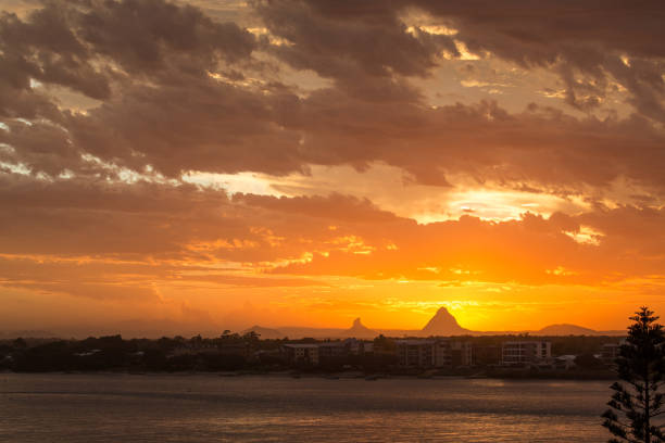 Sunset over the Glasshouse Mountains, Queensland, Australia Photo taken from Caloundra, Sunshine Coast caloundra stock pictures, royalty-free photos & images