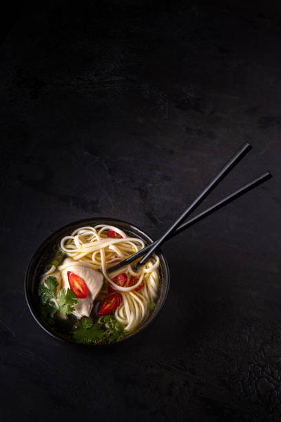 istock Spicy asian soup on black with copy space 1264600714