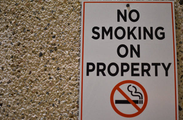 No smoking on property sign No smoking on property sign copyright free medical stock pictures, royalty-free photos & images