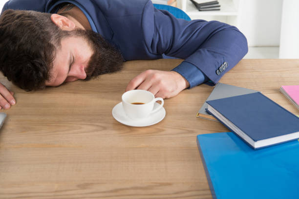 istock Tired businessman sleep in office. boss fell asleep on table. Man sleeping over workplace. coffee will help me. bored and exhausted guy sleep at work. need break for relax. being lazy 1264608936