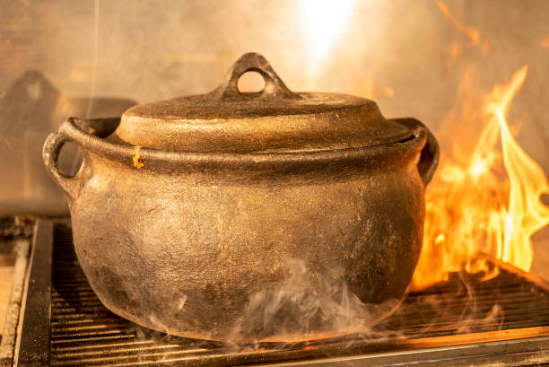 istock casserole is cooking on the cuisine with flame and smoke 1264609751