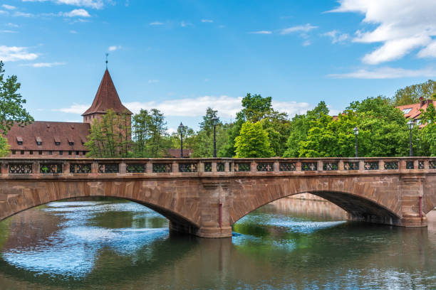 Old stone bridge in the summer under the blue sky in  Nuremberg.