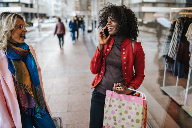 istock Happy women in shopping 1264611047