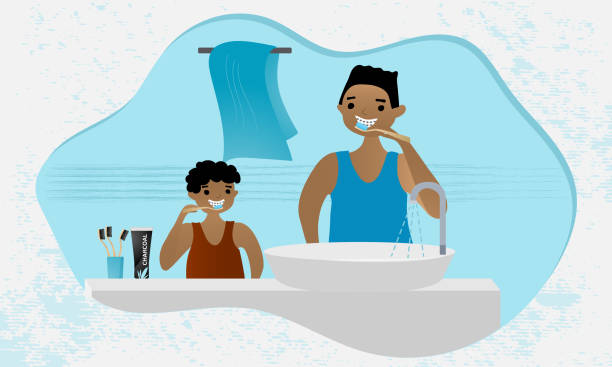 African American father and son brushing teeth with charcoal toothpaste and bamboo toothbrush. Morning routine in the bathroom. Dental health concept illustration. Flat vector. black man brushing teeth stock illustrations