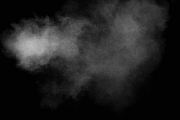 istock White talcume powder explosion on black background. White dust particles splash. 1264613555