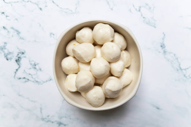 istock Boiled fish balls in white bowl on marble table background. 1264614725