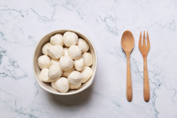 istock Boiled fish balls in white bowl on marble table background. 1264614739