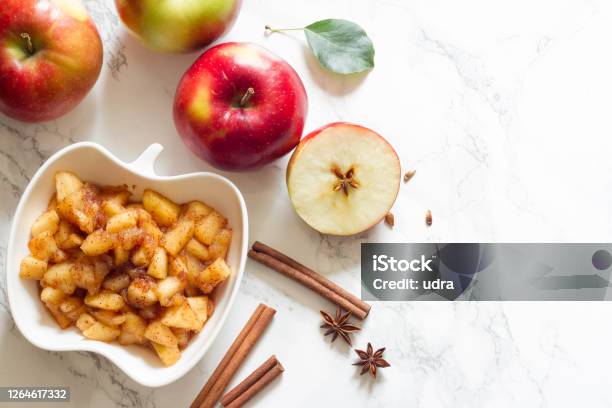 Apples Cinnamon And Chunky Applesauce On White Background Stock Photo - Download Image Now
