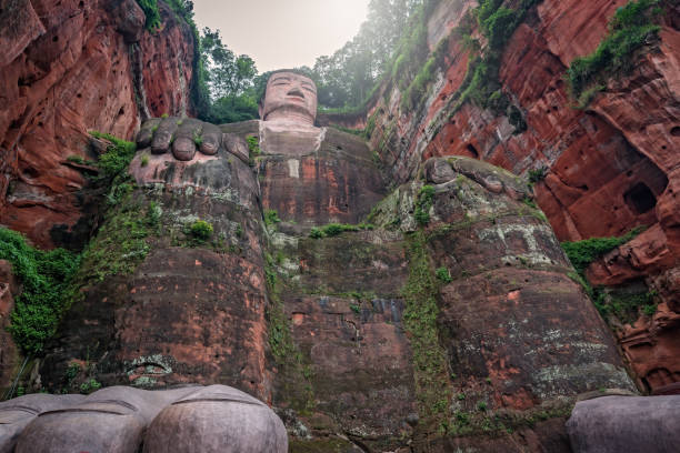 The Giant Leshan Buddha, a 71-meter tall stone statue built between 713 and 803 during the Tang Dynasty. Located at the confluence of the Minjiang, Dadu and Qingyi rivers in the southern part of Sichuan province, China