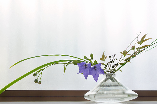 japanese-styled flower arrangement for summer with a large text space
