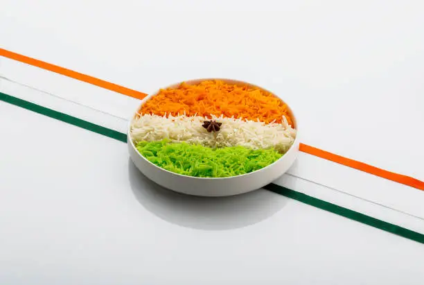 Photo of Indian Tricolour or Tiranga Rice for Indian Republic and Independence day celebration served in a ceramic plate