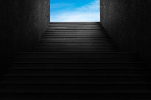 istock Front view architecture of concrete staircase leading to blue sky. 1264622399
