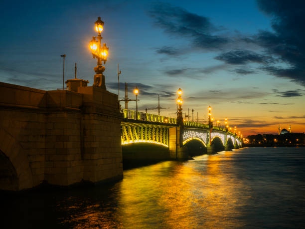 istock Drawnbridge with night lighting over the river in the city 1264626501