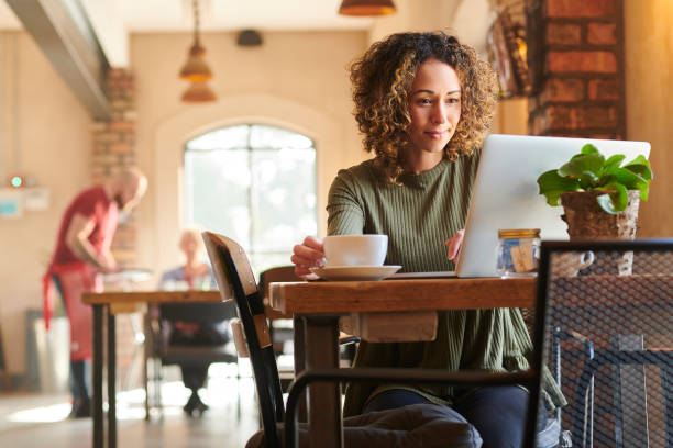 istock checking emails  at the coffee shop 1264628148