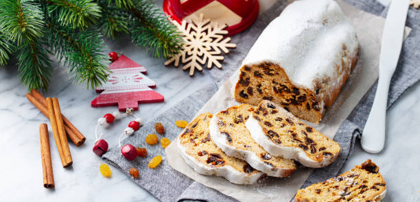 istock Christmas stollen. Traditional German festive dessert. Marble background. 1264632124