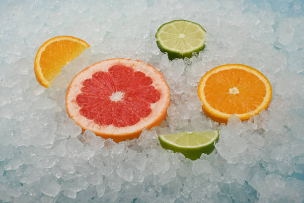 Fresh citrus fruit slices over crushed ice