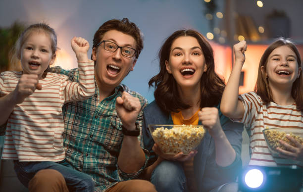 istock Mother, father and daughters spending time 1264639353
