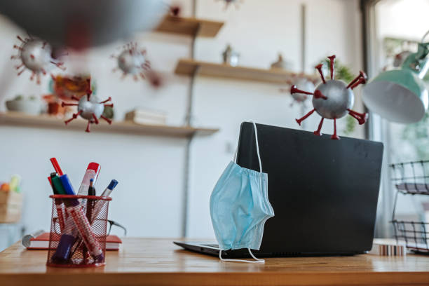 istock Airborne virus floating around at office 1264640498