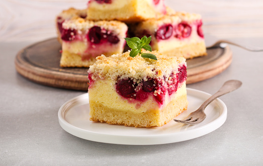 Cherry and coconut cheesecake, served on plate