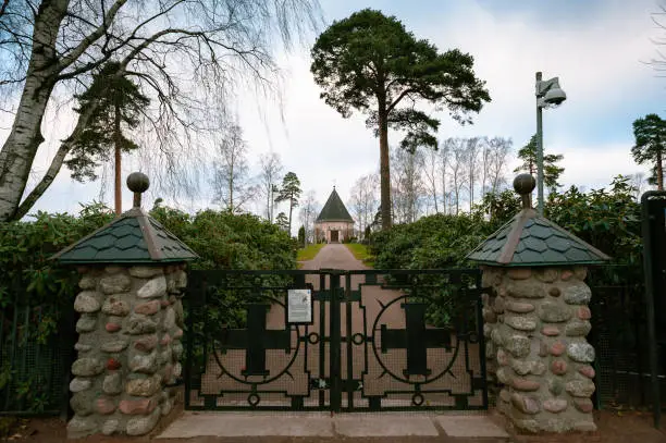 Photo of Cemetery gate and a small chapel in the background