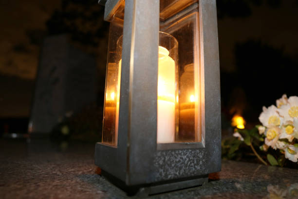 Lighting candles for the dead on All Saints Day