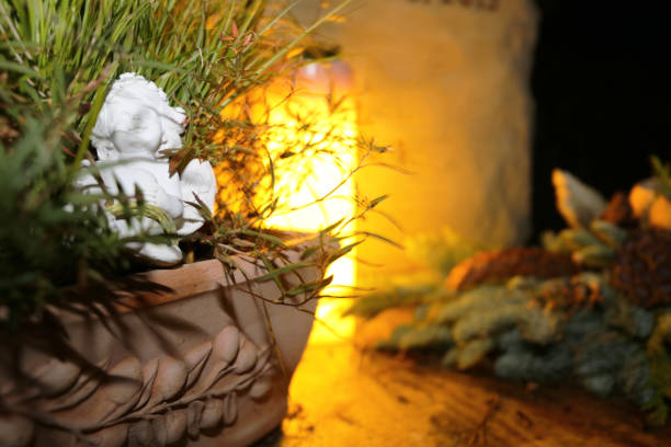 Lighting candles for the dead on All Saints Day