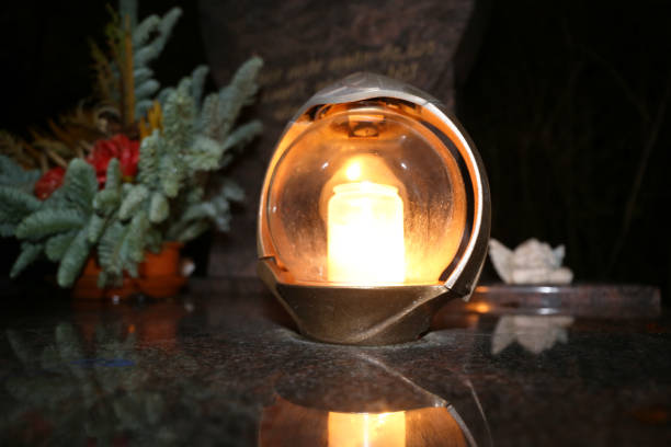 Lighting candles for the dead on All Saints Day