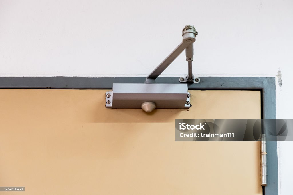Clean door closers for a private room. Clean door closers for a private room of the manager in the office building. Approaching Stock Photo