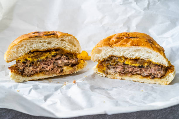 istock Half Cut Stack of Two Pieces Hamburger / Cheeseburger or Burgers Ready to Serve and Eat. 1264653533