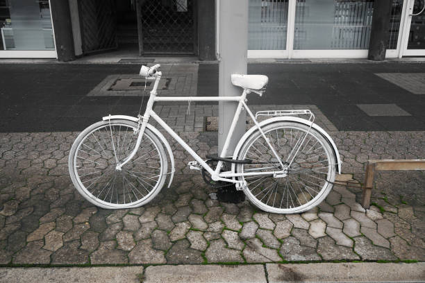 ghost bike or ghostcycle or whitecycle roadside memorial for cyclist killed in traffic accident